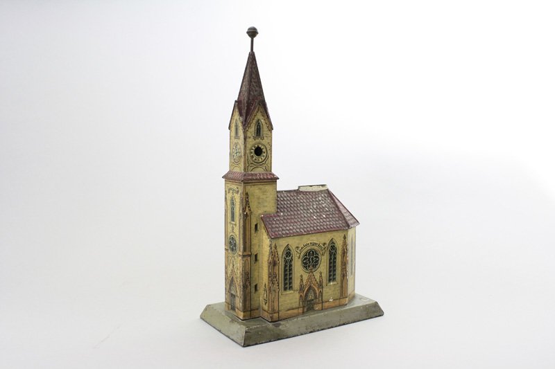 Church with Cigar Architectural Bank: Cutter German - Circa 1900 - 12.5” Tall This is an alms box for the poor. Marked Geden der Armen. Material: Tin