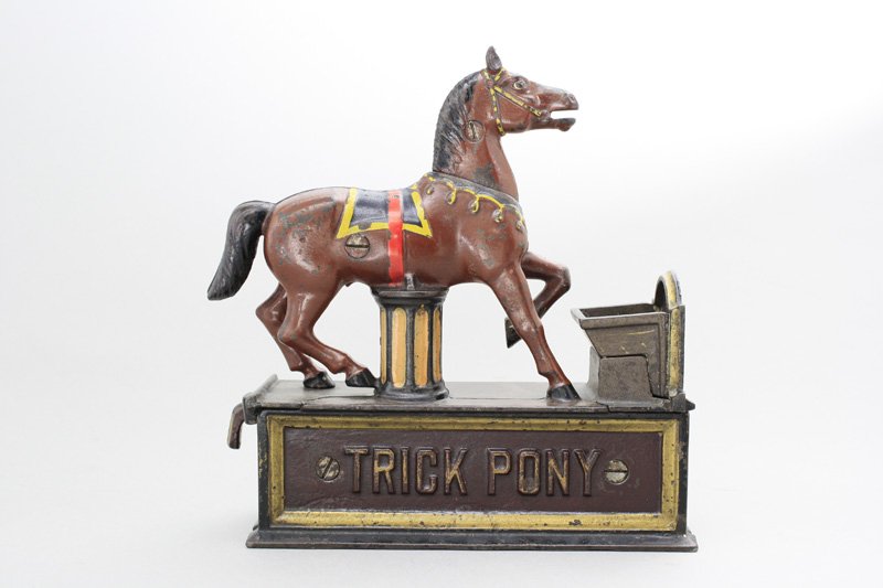 Trick Pony Bank Mechanical Bank: Shepard Hardware Company Buffalo, New York - Circa 1888 Place a coin in the pony’s mouth and pull the lever. The pony deposits the coin into the trough. Material: Cast Iron