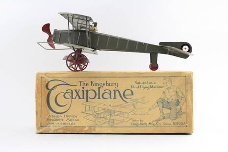 Windup Taxiplane with Box: Kingsbury Mfg. Co. New Hampshire - Circa 1920 - 15” Long Kingsbury toys are seldom found in their original box. It appears to be an American WWI Era biplane, but the box calls it a “Taxiplane”.