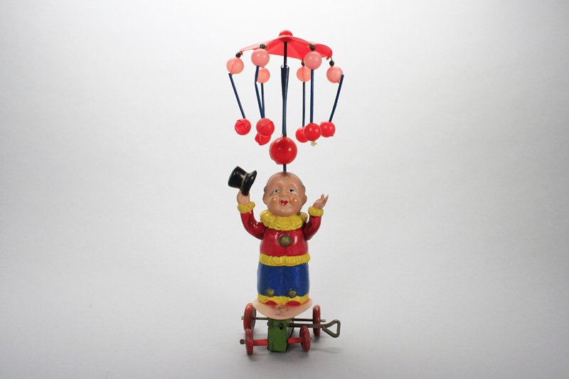 Clown Ringleader: Japanese - Circa 1950’s - 9” Tall This beautiful celluloid toy is in superior condition and works well. Material: Tin and Celluloid