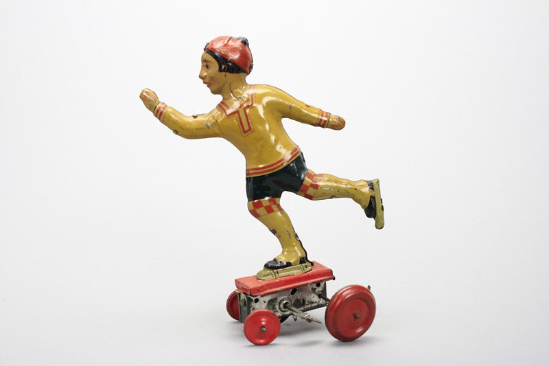 Girl Ice Skater: George Levy (Gely) Germany - Circa 1935 - 7.5” Tall A wonderfully lithographed toy that works well. Material: Tin