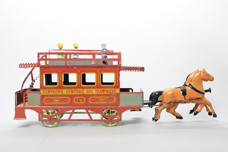 “Compagnie Generale des Tramways”: French - Circa 1890 - 18” Long A truly beautiful toy from an era that has long passed us (sadly). This toy is in amazing condition considering its delicateness. Material: Tin and Papier mache Figure