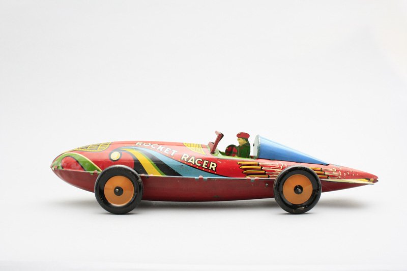 Rocket Racer Louis Marx: New York - Circa 1935 - 16” Long This is one of the most graphic toys produced by Louis Marx. It works very well. Material: Tin