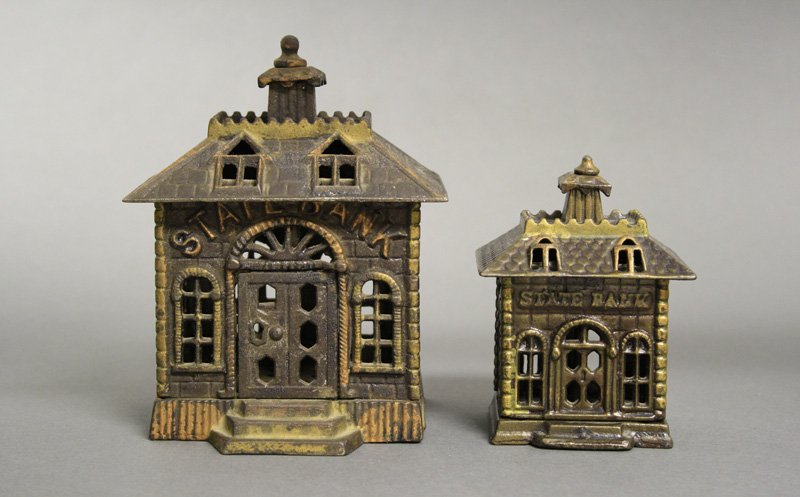 Two State Banks: Kyser & Rex - Circa 1890s Included: State Bank with Key Lock Door (5.875”) and State Bank, Straight Letters (4.125”). Material: Cast Iron