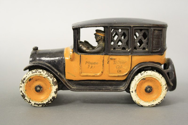 Yellow Cab, Cast Iron Wheels: Arcade Mfg. Co. - Circa 1921 Material: Cast Iron
