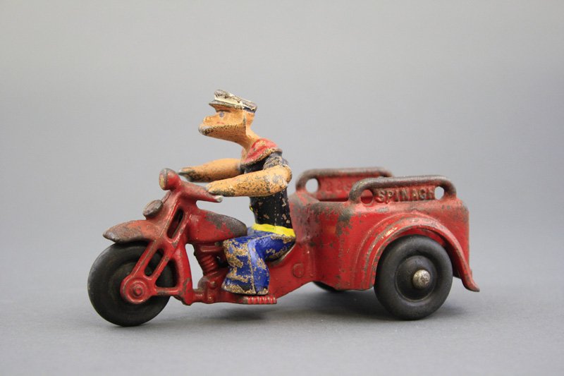 Popeye “Spinach” Motorcycle: Hubley Mfg. Co. - Circa 1935 - 5.5” L A nice example with the original driver. Material: Cast Iron
