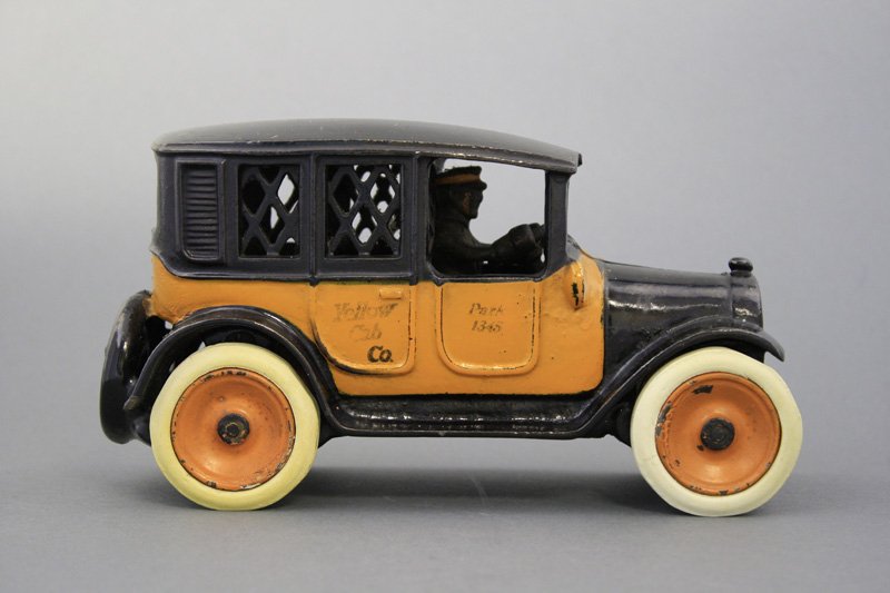 Yellow Cab Bank: Arcade Mfg. Co. Freeport, Illinois - Circa 1923 - 8” L This is a superior example of the bank. Material: Cast Iron