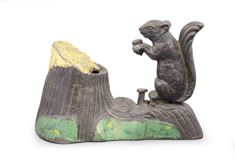 Squirrel and Tree Stump: Made by Mechanical Novelty Works New Britain, Connecticut - Circa 1880 Like the squirrel who saves acorns in a hollowed out tree stump, the child who saves pennies will turn them into dollars and ther