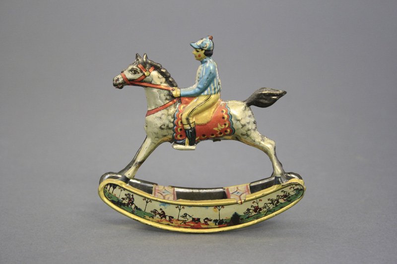 Rocking Horse & Jockey Penny Toy: J. Meier German - Circa 1915 - 4” L Fantastic lithography on this toy. Material: Tin