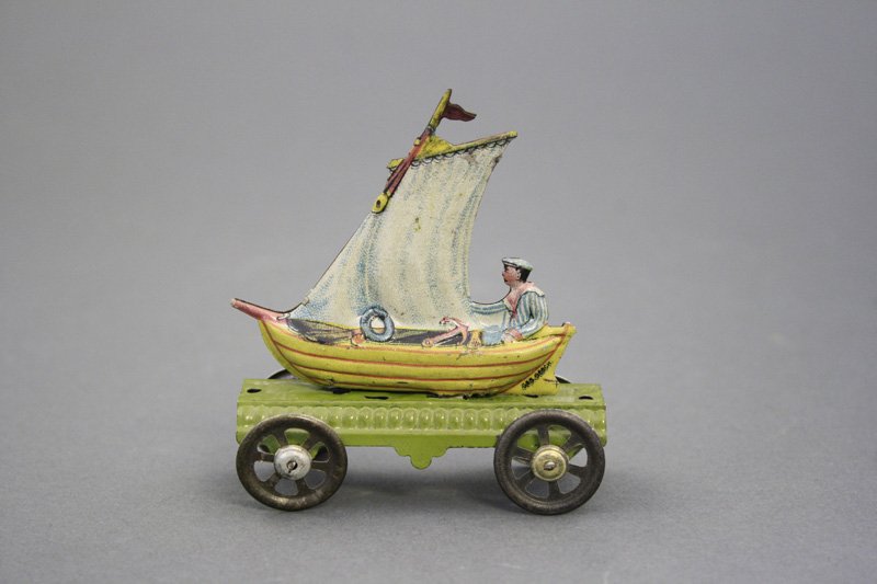 Sailboat Penny Toy: J. Meier German - Circa 1915 - 3.25” L A scarce and desirable penny toy in excellent condition. Material: Tin