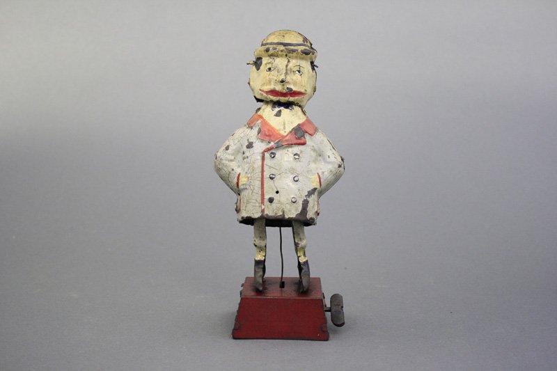 Comical Man on Base: Gunthermann German - Circa 1915 - 8” H This stylish guy rocks back and forth while his head shakes. Material: Tin