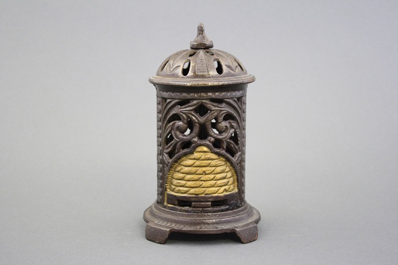 Space Heater with Beehive: English - Circa 1890 - 6.5” H This is a truly superior example. Material: Cast Iron Provenance: Donal P. Markey Collection
