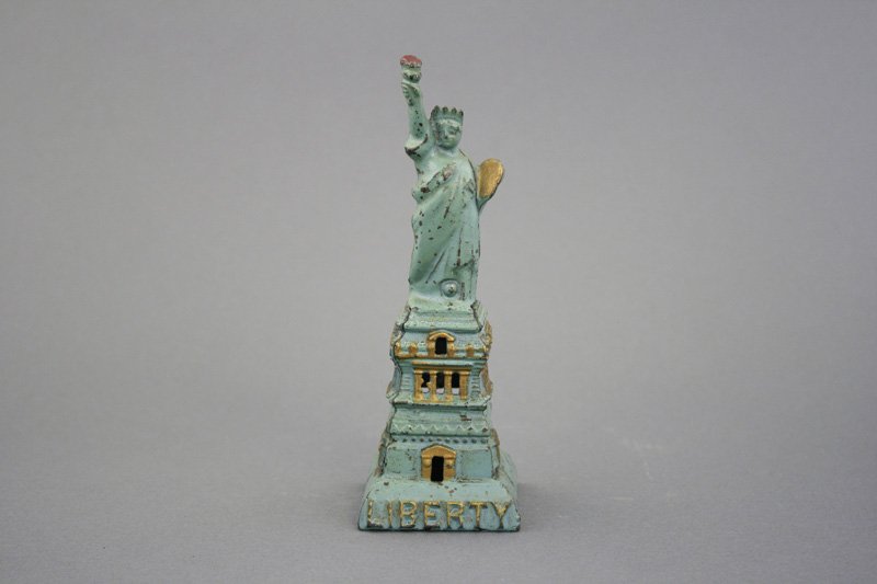 Medium Statue of Liberty Aqua Blue and Gold: Kenton Hardware Kenton, Ohio - Circa 1915 - 6.375” H Material: Cast Iron Provenance: Tom Kellogg Collection