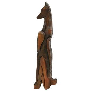 Doberman Pinscher Sculpture by George Mullen: Animal sculpture in red pine of a Doberman Pinscher dog by multi-disciplinary artist George Mullen. The sculpture is made like a puzzle with different carved pieces assembled together. A prolific