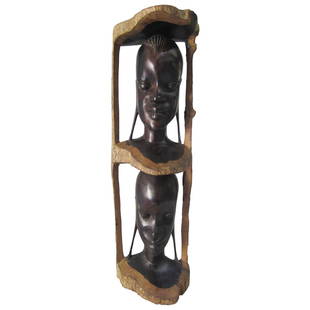 Tribal Totem Pole Sculpture: This Tribal Totem Pole Sculpture is very finely carved in one chunk of ebony. A beautiful African piece that will be the focal point of your living space Price $550 Condition 