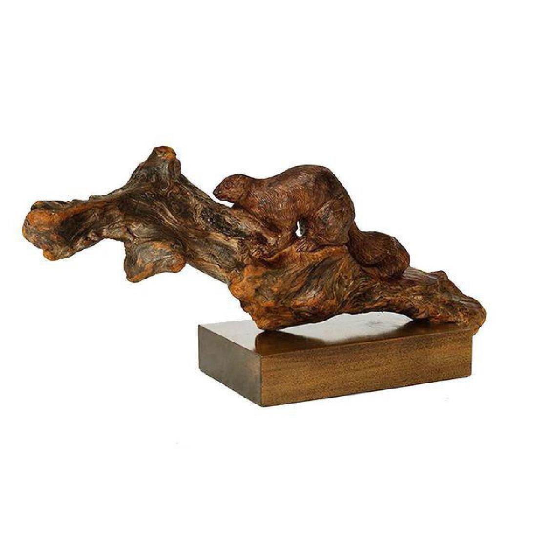 Wood Sculpture of a Squirrel on a Branch: This wooden sculpture features a squirrel finely carved and sitting on a branch. A walnut base supports the sculpture. A rustic touch for the nature loving decorator! Price $180 Condition Goo