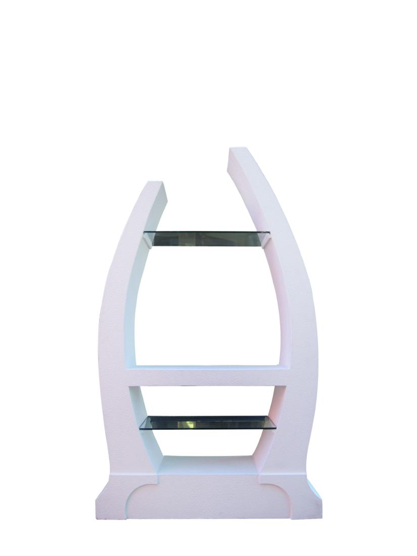 Sculptural Post-Modern 1980s Vitrine: This playful 1980s vitrine in plaster features a central shelf flanked by two glass ones. The shelving unit is perfect for displaying multiple sculptures and decorative objects. Price $4,600 Period <b