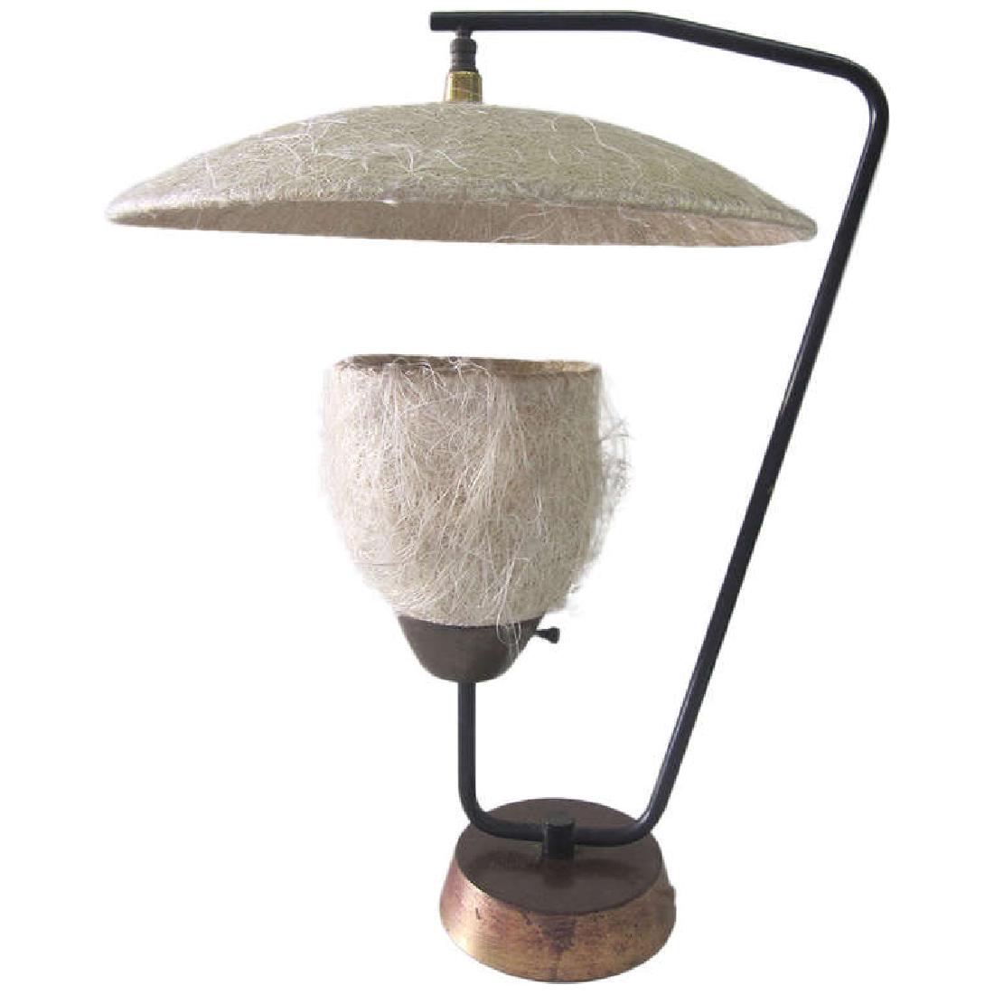 Mitchell Bobrick Style Compressed Fiberglass Lamp: This classic case study era table lamp has much in common with Mitchell Bobrick’s coveted designs. The 1950s lamp has a shade and reflector made of compressed fiberglass hair connected by an iron su