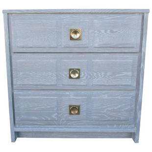 Three-Drawer Little Chest of Drawers: This little chest is made of oak which has been light gray stained and white cerused. The three drawers feature brass ring on a square frame. Original Retail Price $1,600 Period 