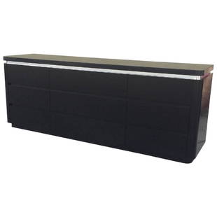 Chic Dresser in Black Lacquer and Brushed Steel: This nine-drawer dresser features a finish in black lacquer and brushed steel banding under the top. Two matching nightstands are available. Original Retail Price $5,200 Period 