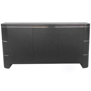 Three Door Credenza in Black Lacquer and Brass: An elegant buffet featuring a finish in black lacquer with brass banding below top and in two other lower bands on ends. The rounded frame of this 1970s piece has three push-lock doors which open to