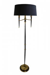 French 1950s Floor Lamp: This 1950s floor lamp from France features a brass base which supports a thin black column decorated at the middle with brass rosettes. At the top, a trio of faux candles on tapered holders provide