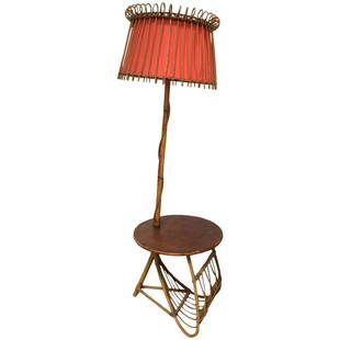 French Bamboo Floor Lamp with Magazine Rack: Side table and lamp in bamboo and orange canvas, This piece features great circular detailing around the edges of the shade and a symmetrically styled triangular base magazine rack under a floating ro