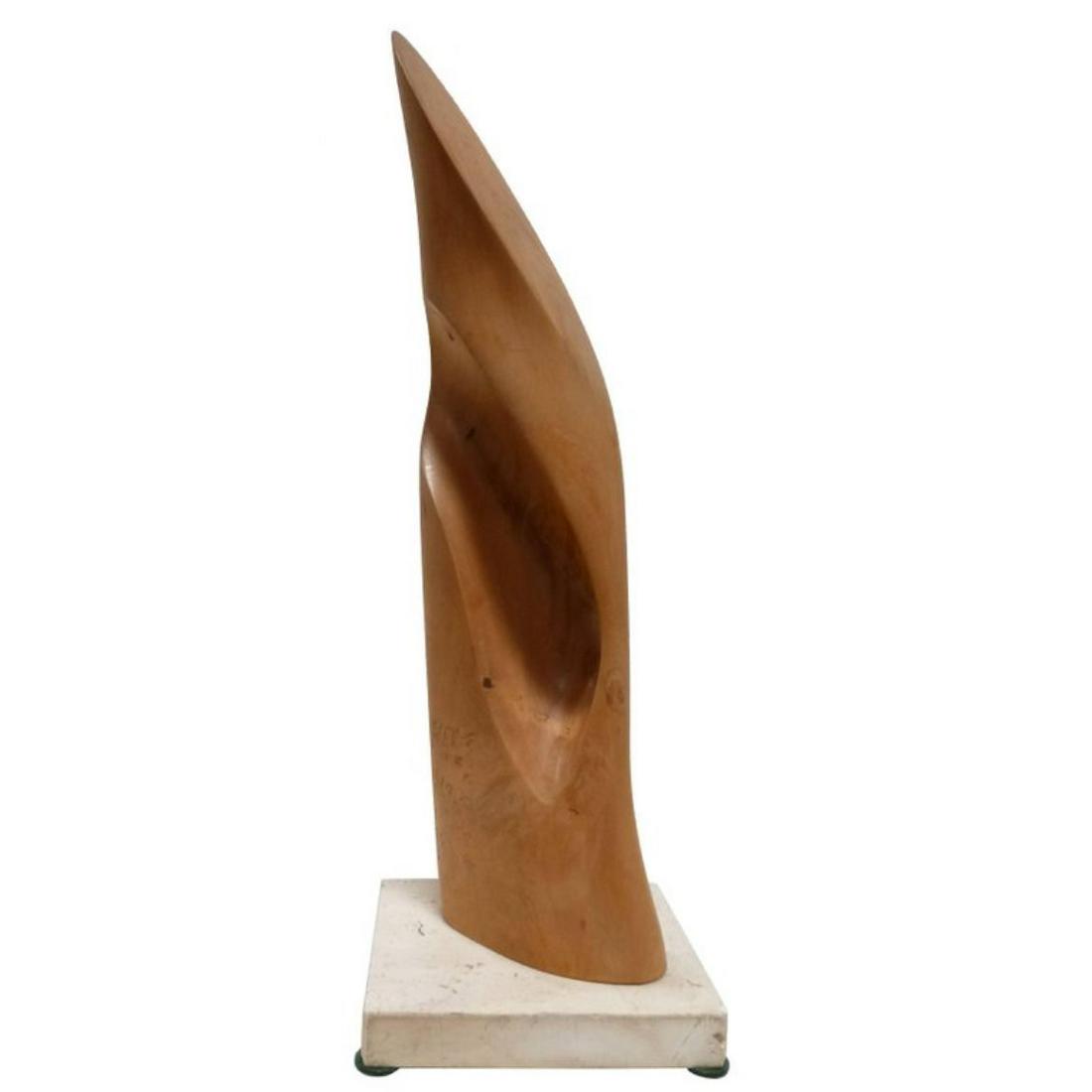 Organic Wood Sculpture by Les Kleinberg: Phallic wood sculpture has a sloped top and smooth surface. Sculpture is mounted on a travertine base which is signed on the bottom "Les Kleinberg 1976". Height: 14.0" Width: 4.75" Depth: 4.0"