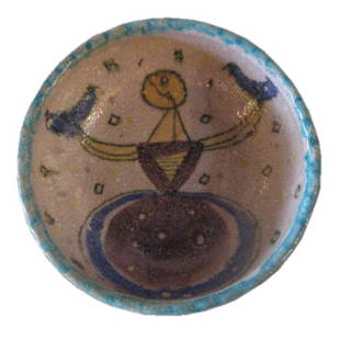 Italian Mid-Century Large Bowl by Guido Gambone: Whimsical Italian and mid-century bowl displays a lady in a dress holding two birds. The design on the inside is a vibrant yellow, blue and purple while the exterior is turquoise and slightly