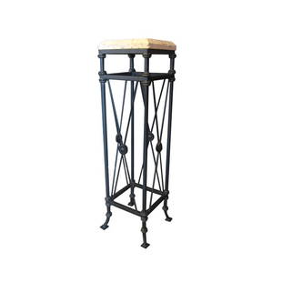 A Neo-Classical High Pedestal: A neo-classical design pedestal which resembles the "Directoire" period of French styles. Iron base with travertine top. 54.5 in. H x 14 in. W x 14 in. D