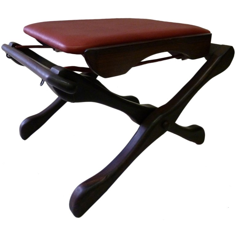 Classic Sling "Swinger" Ottoman by Don Shoemaker: This classic 1960s ottoman from the Mexican workshop of Don Shoemaker features his iconic suspended sling and organic bone like elements hand-crafted in solid Cocobolo rosewood. It has been recovered