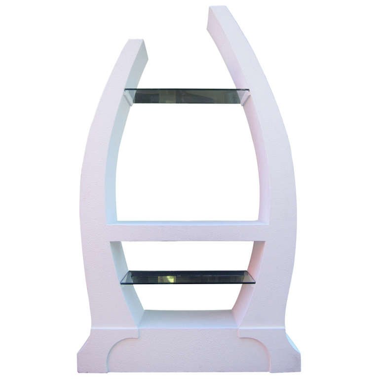 Sculptural Post-Modern Vitrine: This playful 1980s vitrine in plaster features a central shelf flanked by two glass ones. The shelving unit is perfect for displaying multiple sculptures and decorative objects.Dimensions - 80 in. H x