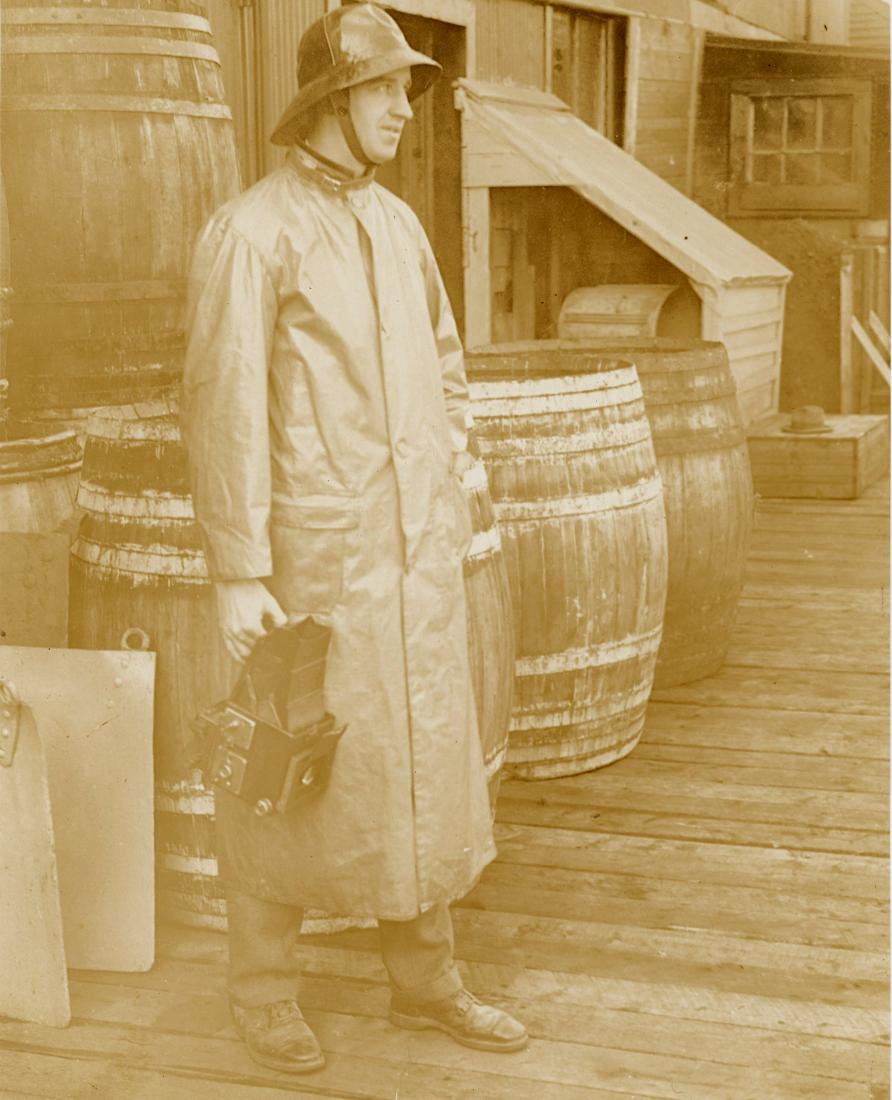 Photographer with Graflex Camera.: Photographer with Graflex Camera. Fair contrast, small tear repaired at bottom. 9.625 x 7.375 in.