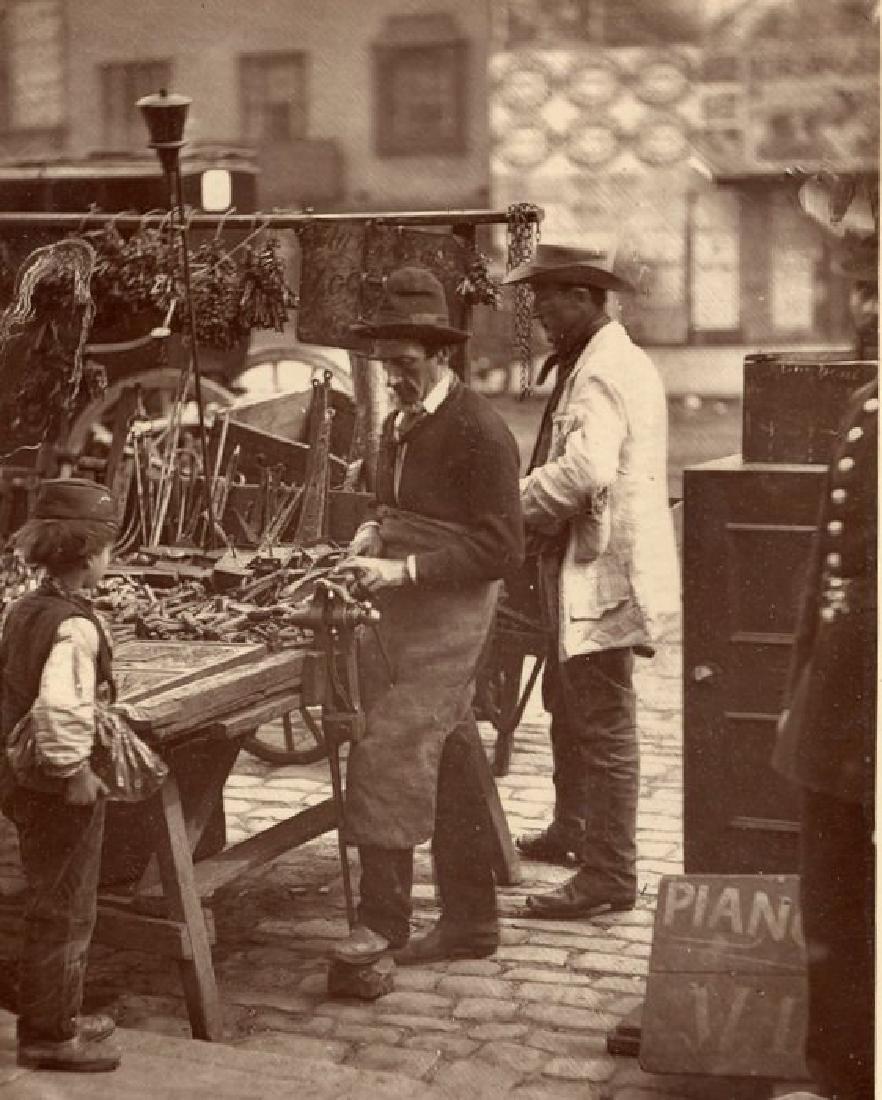 Carbon print -The Street Locksmith. c1877: Carbon print (Woodburytype) - The Street Locksmith C1877. From John Thomson's famous series Street Life in london. 1877. Exceptional contrast and tonality. 4.5 x 3.375 in. 11.5 x 8.5 cm. Unless otherw
