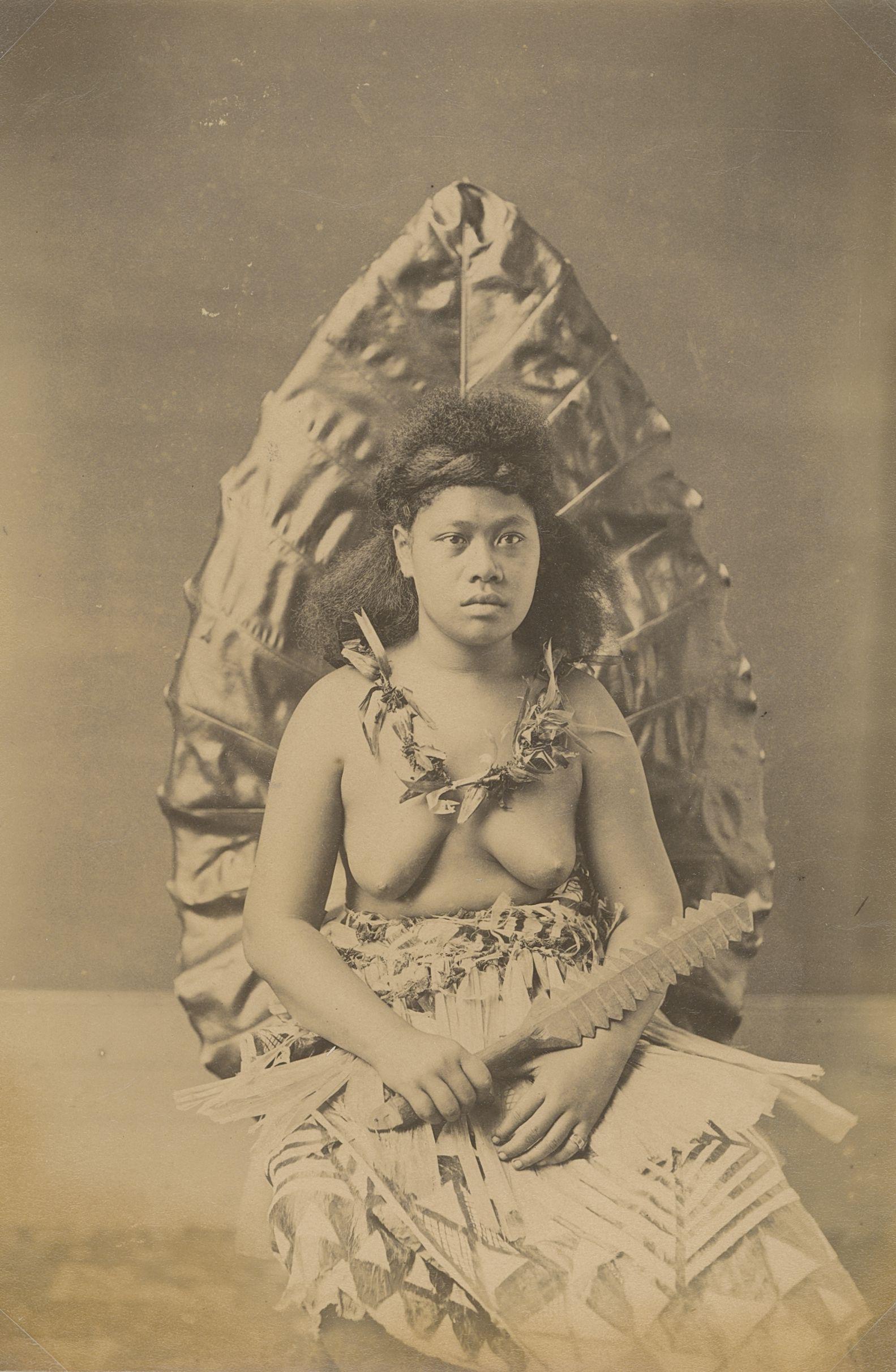 Samoan Woman holding a War Club, c1893: Samoan Woman holding a War Club, c1893. Good contrast and tonality, bottom edge fading. Attributed to John Davis. 8.125 x 5.375 in. 20.64 x 13.65 cm