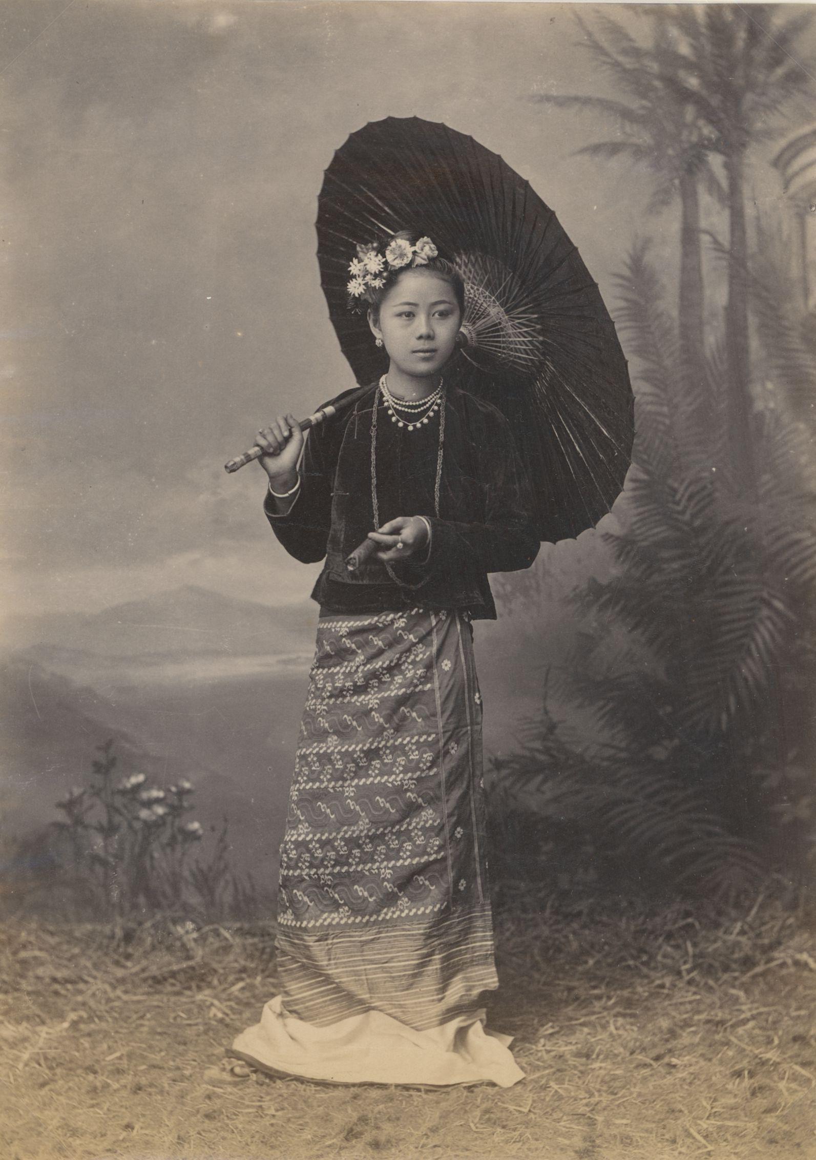 BURMA. Burmese Beauty smoking a Cigar. C1880: Burmese Beauty smoking a Cigar. C1880. Good contrast and tonality, fading toward lower area. Unknown photographer. 7.5 x 5.25 in. 19.05 x 13.34 cm