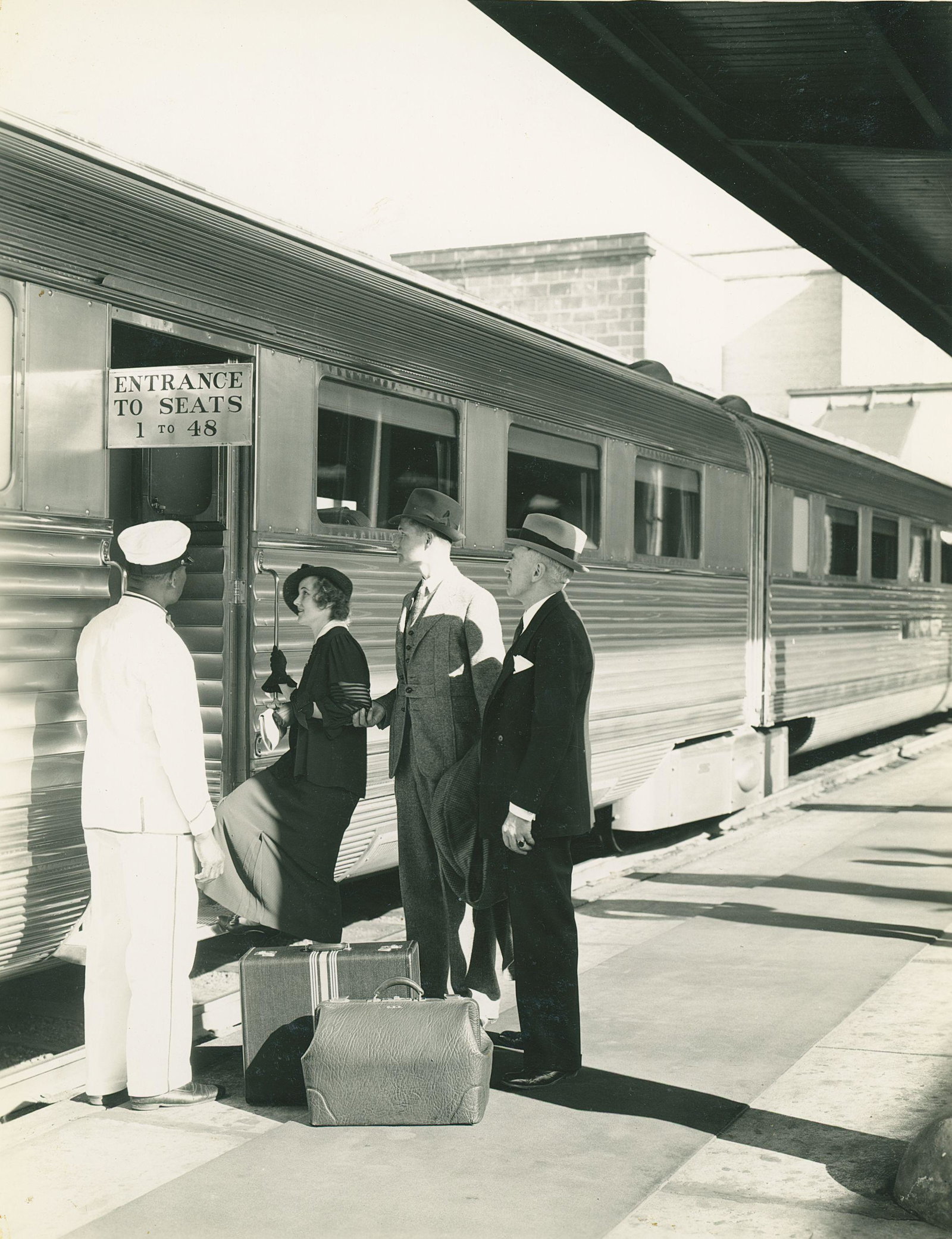 Lucille Boarding a Train. C1940.: Lucille Boarding a Train. C1940. Very good contrast and tonality. Unidentified photographer. 9.5 x 7.375 in.