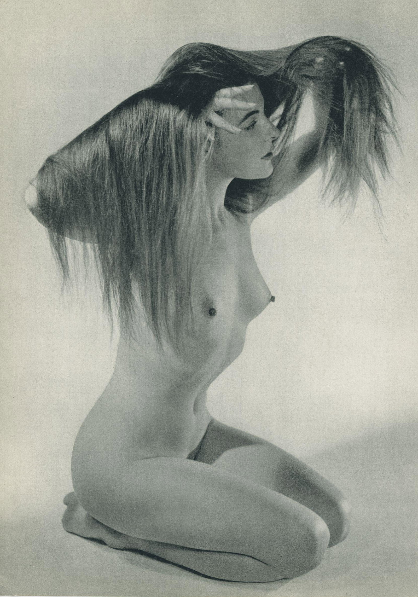 Nude by Zoltan Glass. C1950: Nude by Zoltan Glass. C1950. ZoltÃ¡n Glass was a Hungarian photographer who was one of the renown photographers of the 20th century. 11.5 x 8.125 in. Rev: 11.5 x 8.875 in.