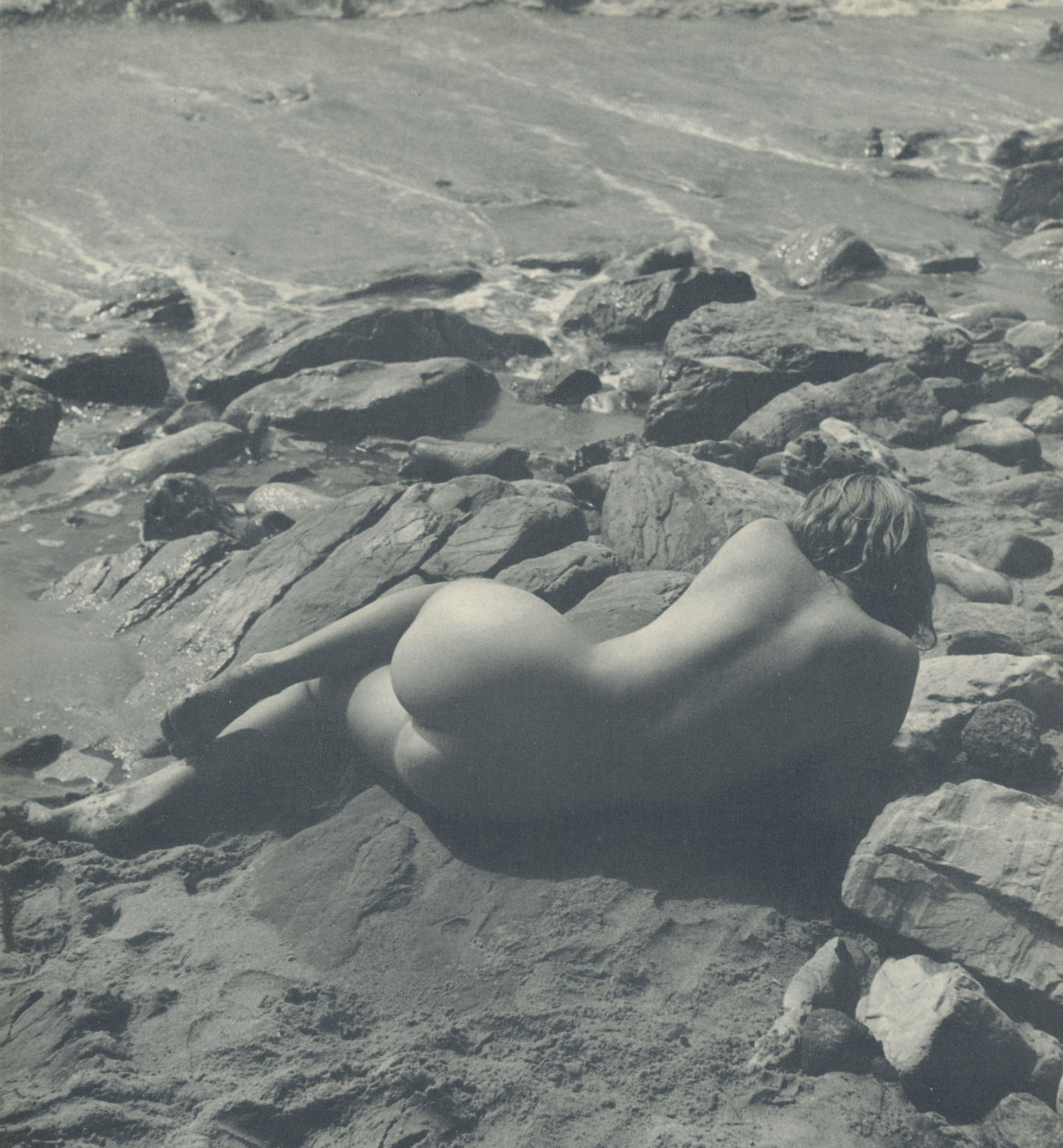 Nude by Andre de Dienes. C1960: Nude by Andre de Dienes. C1960. American-Hungarian photographer famous for nude photography and photographs of a young Marilyn Monroe. 9 x 8.25 in. Rev: 10.75 x 8.25 in.