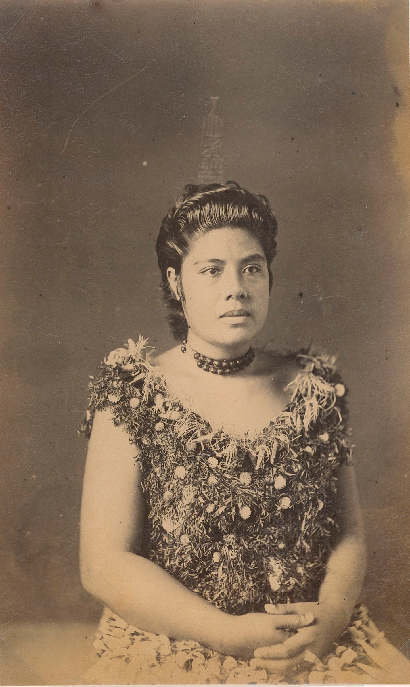 SAMOA. High Rank Samoan Lady. c1893: High Rank Samoan Lady wearing coconut comb. c1893. Very good contrast and tonality, bottom edge fading. Photographer: Attributed to John Davis. 8 x 4.875 in. 20.32 x 12.38 cm