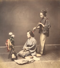 Hair Dresser combing long hair. c1875