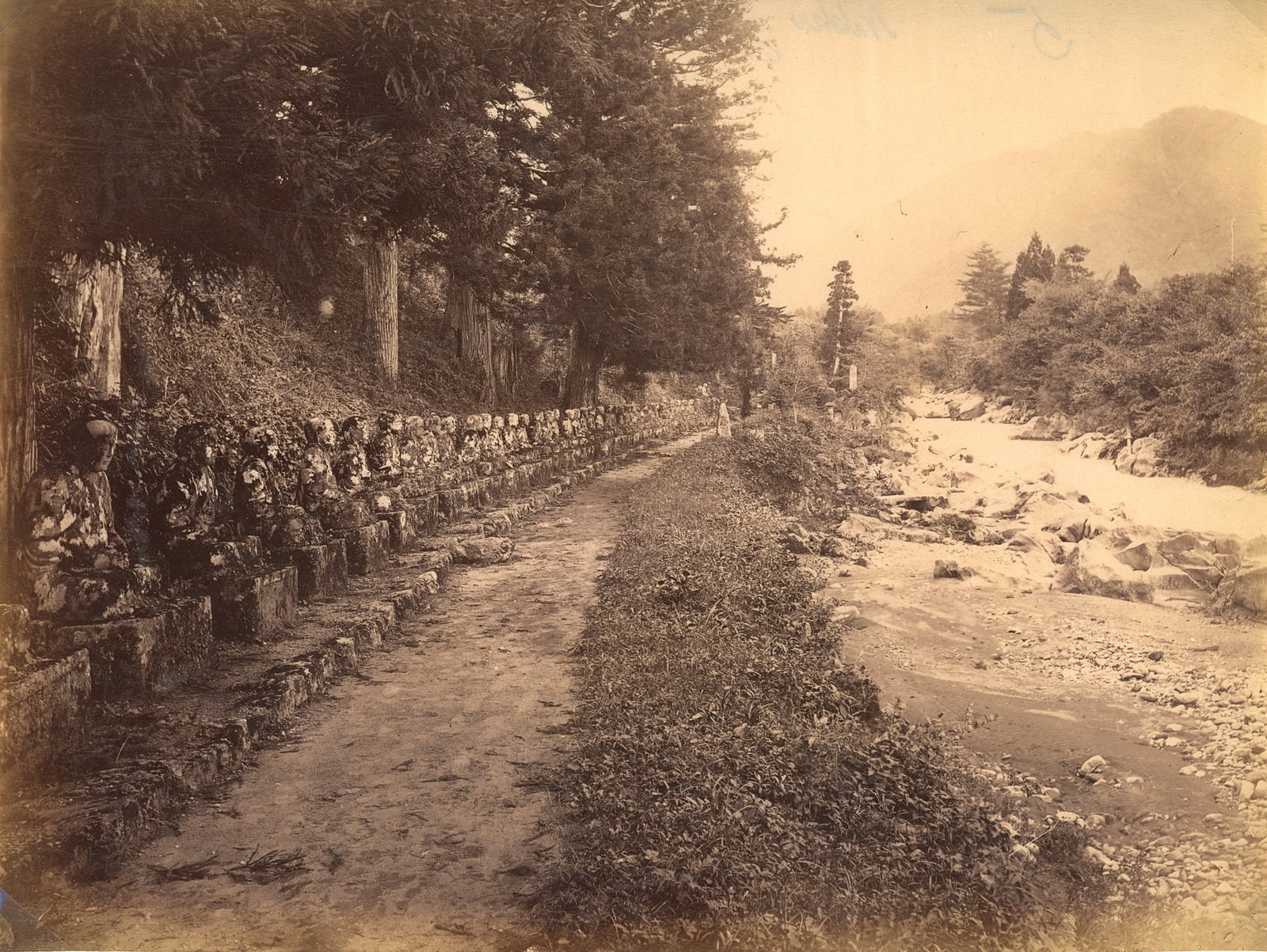 Narabi Jizo, a single line of 74 statues at Kanmangafuchi Abyss, Nikko. c1870: Narabi Jizo, a single line of 74 statues at Kanmangafuchi Abyss, Nikko. C1870. Good contrast and tonality, some edge fading. Unknown photographer. 8 x 10.25 in. 20.32 x 26.03 cm