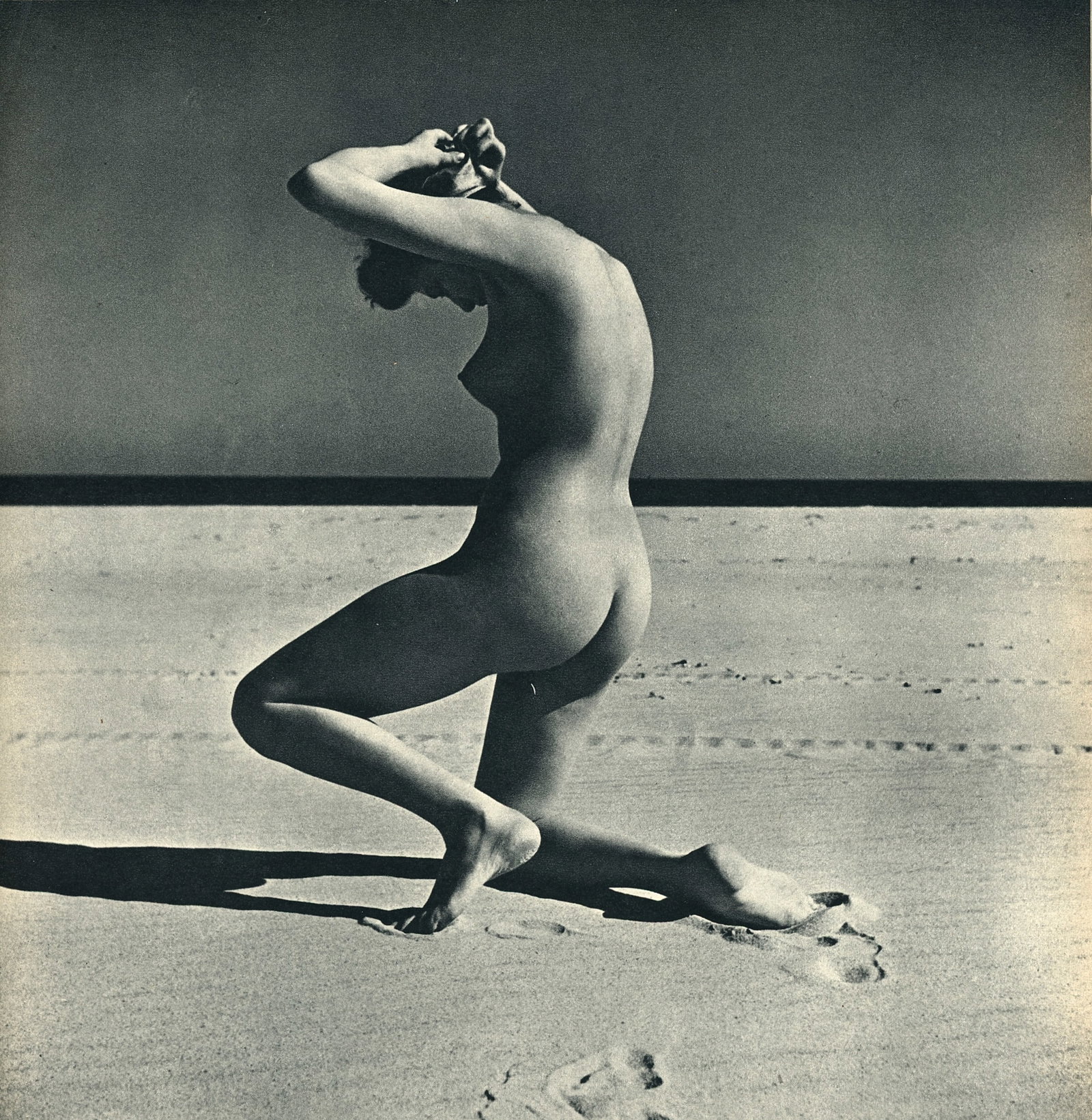 Nude by Andre de Dienes. C1956: Nude by Andre de Dienes. (1913 - 1985). American-Hungarian photographer famous for nude photography and photographs of a young Marilyn Monroe. 8.5 x 8.25 in. Reverse: 8.5 x 8.25 in.