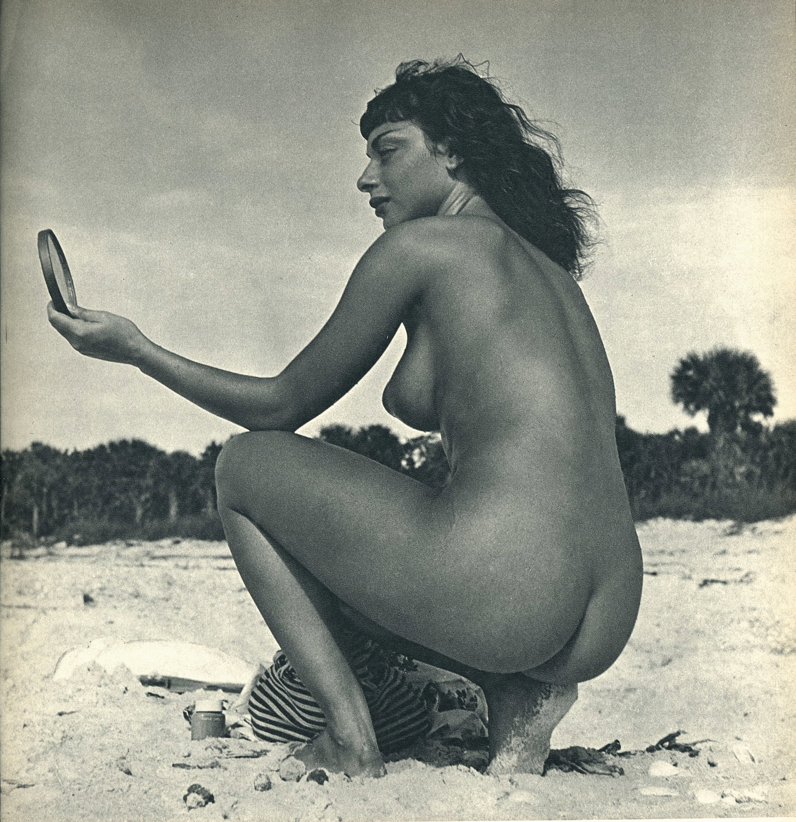 Nude by Andre de Dienes. C1956: Nude by Andre de Dienes. (1913 - 1985). American-Hungarian photographer famous for nude photography and photographs of a young Marilyn Monroe. 8.5 x 8.25 in. Reverse: 8.5 x 8.25 in.