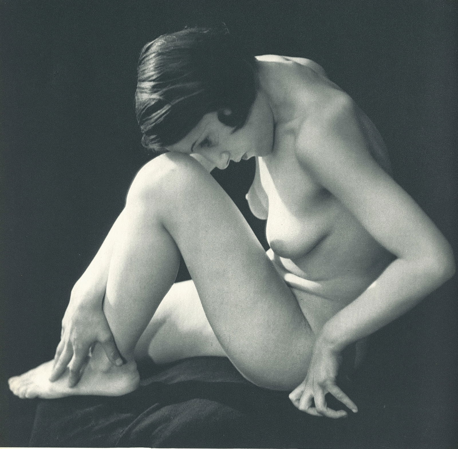 Nude by George Louis Arlaud. C1936: G.L. Arlaud (1869 - 1944) was a French photographer known for his outdoor nude studies he took in the South of France. He settled in La Ciotat in 1942, where he was assassinated in 1944, the day after