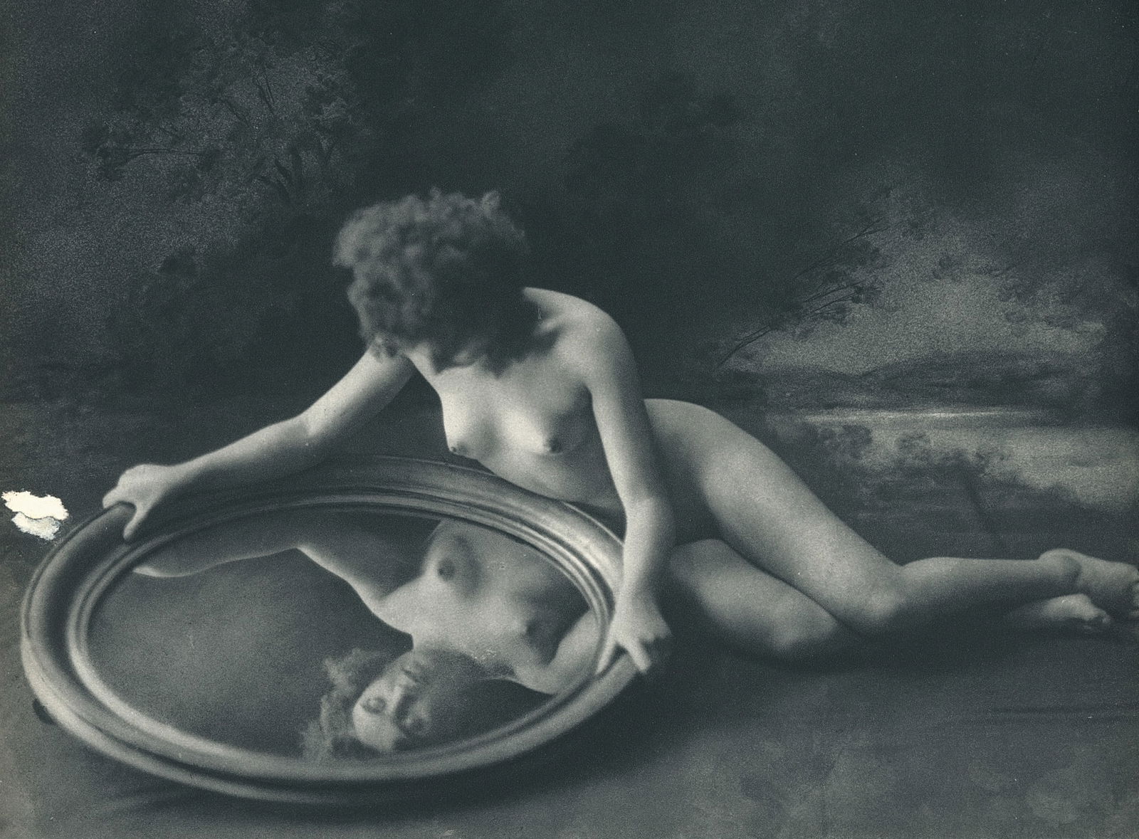 Nude by George Louis Arlaud. C1936: G.L. Arlaud (1869 - 1944) was a French photographer known for his outdoor nude studies he took in the South of France. He settled in La Ciotat in 1942, where he was assassinated in 1944, the day after