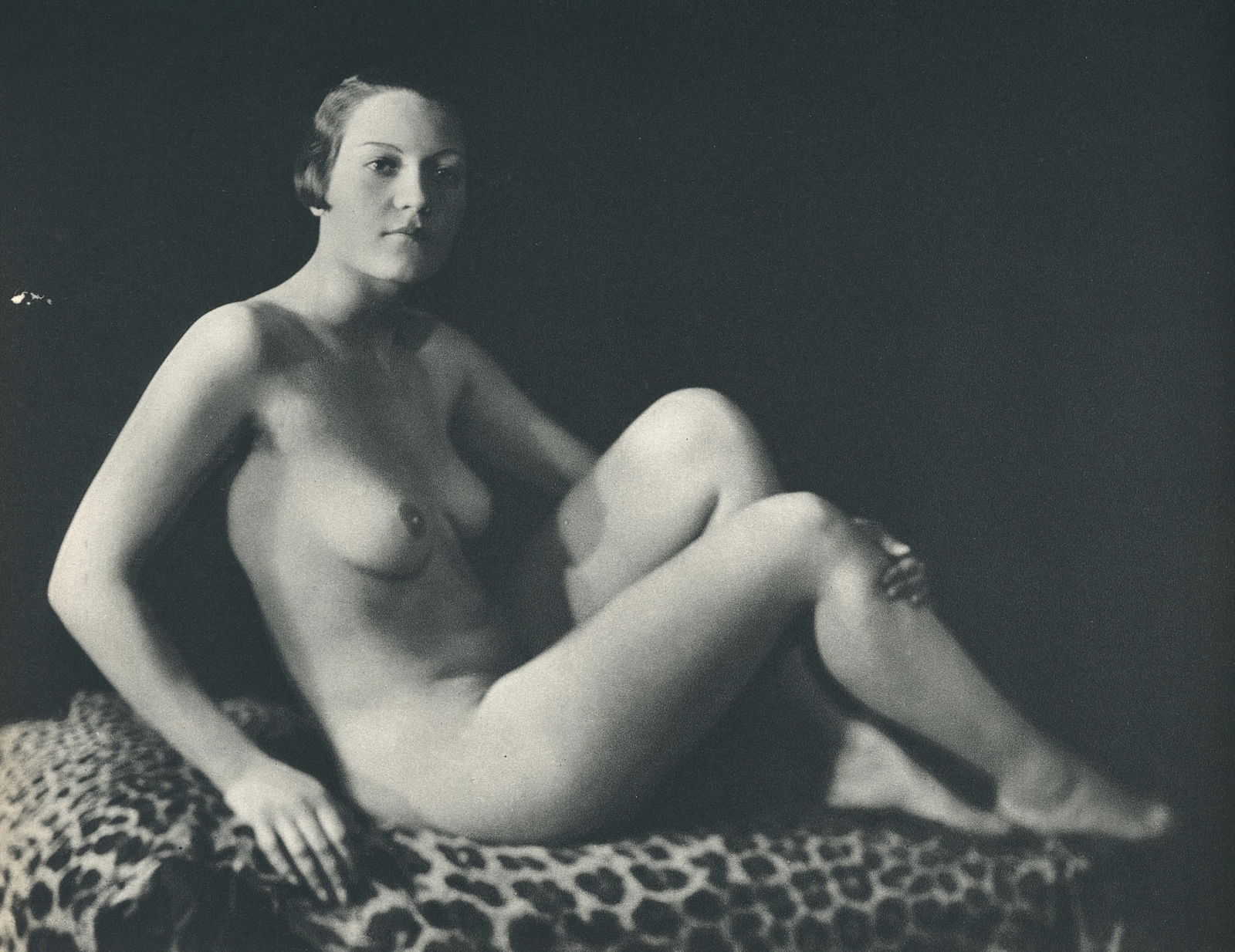 Nude by George Louis Arlaud. C1936: G.L. Arlaud (1869 - 1944) was a French photographer known for his outdoor nude studies he took in the South of France. He settled in La Ciotat in 1942, where he was assassinated in 1944, the day after