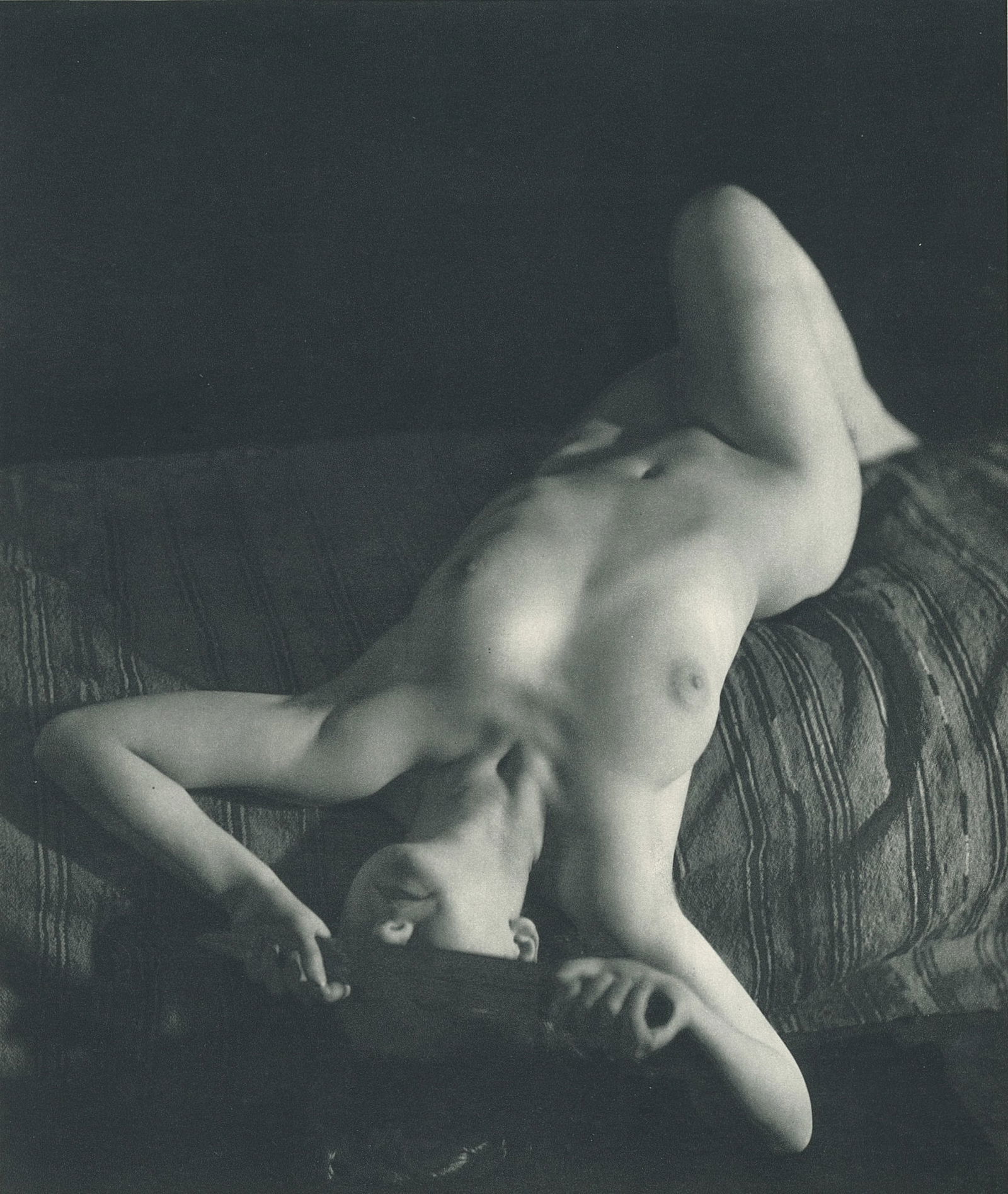 Nude by George Louis Arlaud. C1936: G.L. Arlaud (1869 - 1944) was a French photographer known for his outdoor nude studies he took in the South of France. He settled in La Ciotat in 1942, where he was assassinated in 1944, the day after