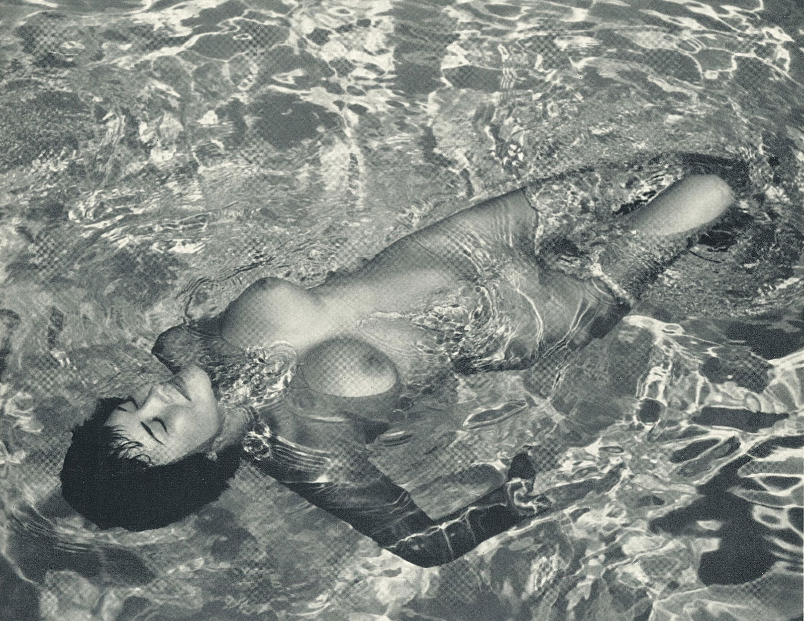 Nude by Andre de Dienes. C1958: Nude by Andre de Dienes. C1958. American-Hungarian photographer famous for nude photography and photographs of a young Marilyn Monroe. 6 x 7.5 in. Reverse: 5.625 x 7.5 in.