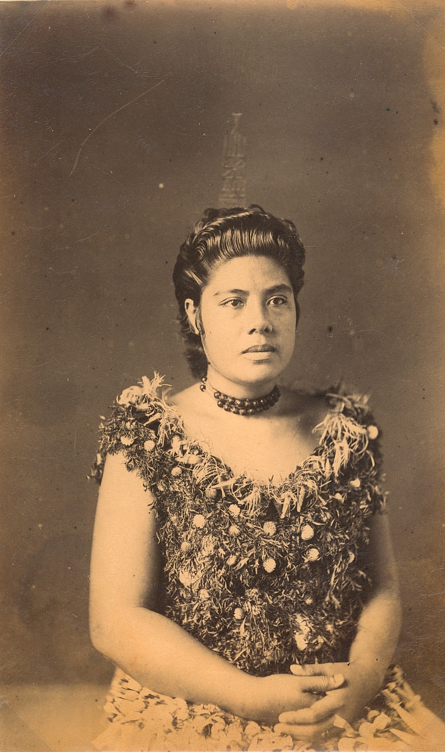 SAMOA. High Rank Samoan Lady wearing cocoanut comb, c1893: High Rank Samoan Lady wearing cocoanut comb, c1893. Very good contrast and tonality, bottom edge fading. Photographer: Attributed to John Davis. 8 x 4.875 in. 20.32 x 12.38 cm